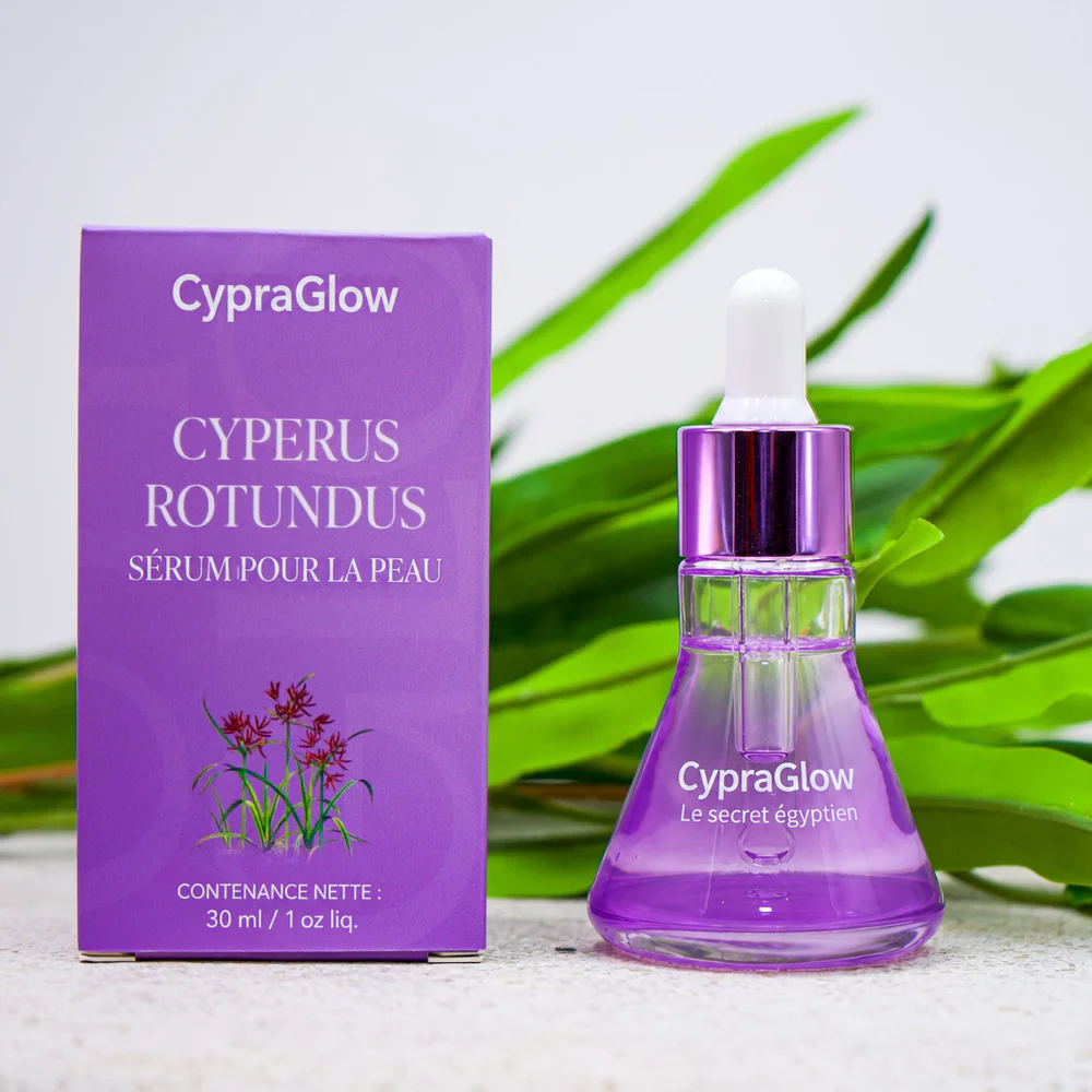 Flacon et boîte CypraGlow avec des feuilles vertes.